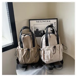 Detail of water-resistant wrinkled nylon texture and drawstring pocket on travel backpack