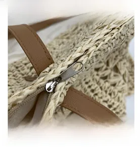Macro detail of high-quality metal zipper and woven texture on a summer beach tote