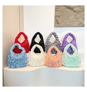 Detail view of colorful pleated satin cloud handbags displayed in eight soft vibrant colors