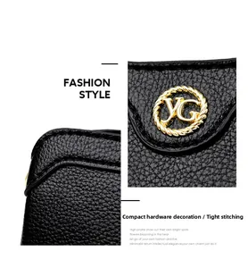 Detailed macro view of black pebbled leather texture with round gold YG metal hardware buckle