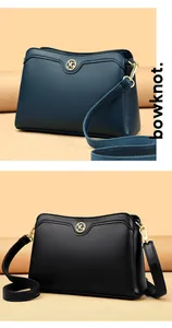 Detail of lychee pattern leather texture and golden metal YG logo on two shoulder bags