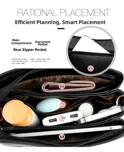 Interior of black leather bag showing main pocket, ID slot and rear zipper pocket