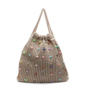 Beige crochet drawstring tote bag with colorful faux pearls and mesh hollow weave design