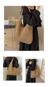 Close-up of handwoven straw tote bag showing detailed paper rope texture and spacious design