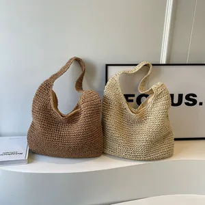 Large hand-woven straw tote bags in beige and cream colors with a minimalist style
