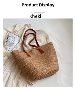 Detail of khaki straw tote bag with brown leather straps and woven texture for summer
