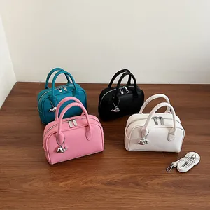 Minimalist Boston handbags in four colors with whale charms and detachable straps