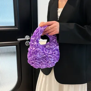 Chic purple ruffled tulle handbag featuring a trendy pleated design and mini ring handle