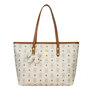 Vintage bedruckte Shopper-Tasche mit Ledergriffen und niedlichem Welpen-Anhänger