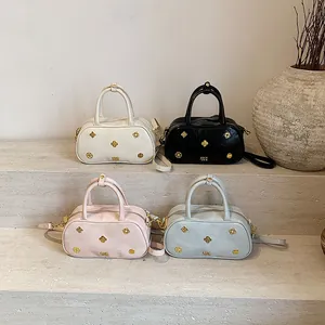 Classic Boston handbag for women in four elegant colors with gold floral hardware