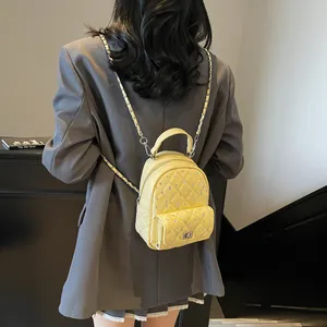 Quilted yellow mini backpack with chain strap and crystal accents for women