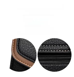 Detail of lychee pattern leather with brown trim and beige contrast stitching