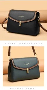 Detail of lychee pattern leather bags with golden twist locks in black and dark blue