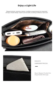 Detail view of the multi-compartment interior and back zipper pocket of this black crossbody bag