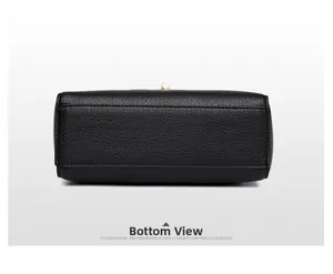 Bottom view of black litchi pattern leather crossbody bag with neat stitching and metal parts