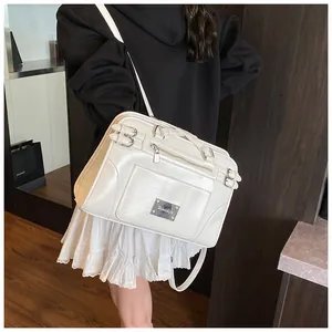 Detail view of cream white PU leather handbag with metal zipper and fine grain texture