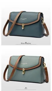 Close-up of small crossbody bags in blue and tea green with litchi grain leather texture