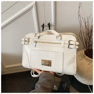 Detail of white PU leather convertible backpack with metal zipper and logo plaque