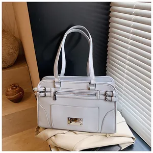 Detailed view of light blue faux leather handbag with silver hardware and front zipper pocket