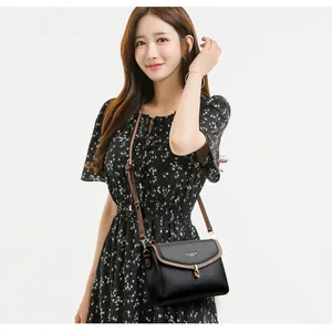 Classic black crossbody bag for women with brown trim and secure metal buckle lock