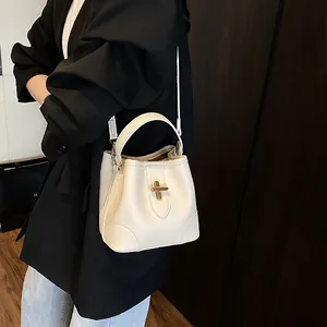Elegant cream lychee pattern bucket bag with golden twist lock for women handheld or crossbody
