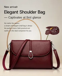 Detailed close-up of wine red lychee grain leather shoulder bag with silver pear-shaped buckle