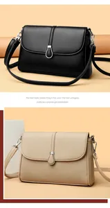 Close-up of litchi texture leather handbag with water drop shape silver metal buckle