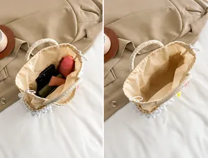 Binnenaanzicht van de rieten tas met ruimte voor telefoon en lippenstift en trekkoord