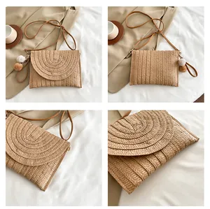 Close-up of bohemian woven envelope bag with layered textures and plush pompom charms