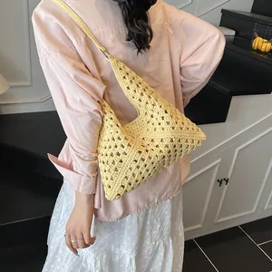Fashionable yellow woven hollow crochet shoulder bag with leather strap for beach vacation