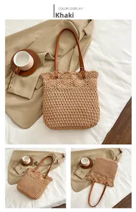 Detailansicht der khakifarbenen Strohtasche mit verstärkten braunen Lederriemen