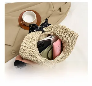 Top view of beige woven straw tote bag showing spacious interior with daily essentials