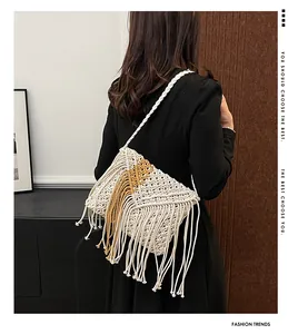 Detail of bohemian woven tassel crossbody bag with yellow geometric pattern and long fringes