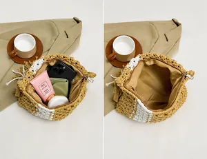 Internal view of the bohemian straw bag showing capacity for phone and essentials