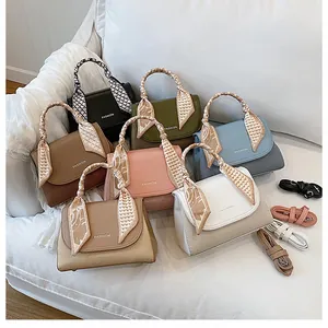 Detail view of stylish crossbody bags in six colors with silk scarf handles and textures