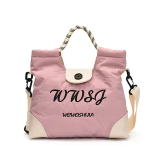 Pink large capacity tote bag with white leather trim and woven checkered handles