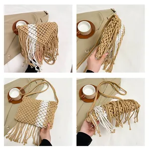 Detail view of woven straw shoulder bag with long fringes and boho patchwork design