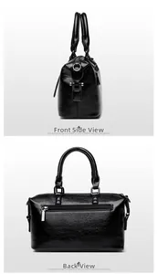 Detail view of black pebbled leather Boston bag showing side profile and back zipper pocket