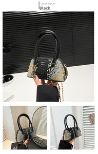 Macro detail of python texture shell bag with gold chain and black dual handles
