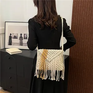 Bohemian fringe woven shoulder bag featuring a dual-tone V-pattern and cotton rope strap