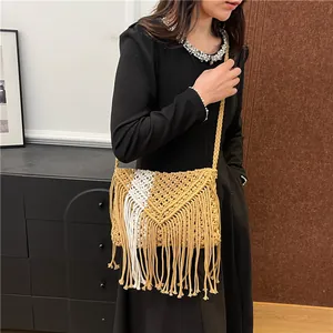 Bohemian macrame straw crossbody bag with v-pattern weave and long fringe tassels
