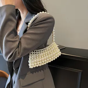 Retro handmade pearl crossbody bag for women featuring woven beaded texture and shoulder strap
