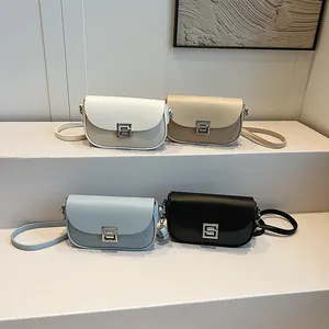 Minimalist vintage saddle bags for women in white, beige, blue and black leather