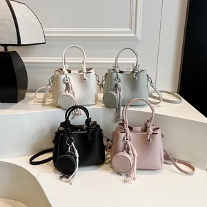 Minimalist bucket bags with litchi texture and mini coin purse charms in four colors