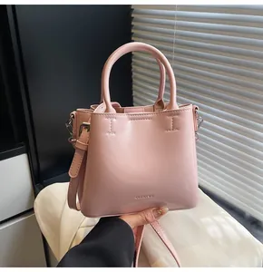 Detailed close-up of pink PU leather bucket bag with CLEAROK logo and shoulder strap