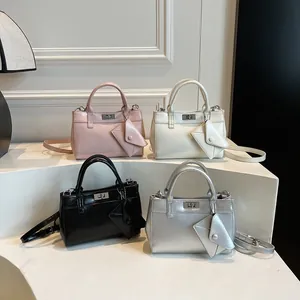 Retro faux leather tote bags in pink, white, black, and silver with mini wallet charms