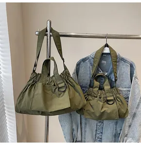 Army green nylon tote bag set in large and small sizes with functional pleated details