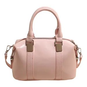 Pale pink Boston handbag in smooth PU leather with silver metal hardware and crossbody strap