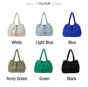 Collection of wave-quilted puffer tote bags in six vibrant colors with drawstring top