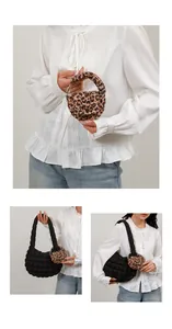 Detail of quilted cloud bag in leopard print and black with plush pleated texture